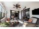 Relaxing sunroom with wicker furniture and view of backyard at 1498 Leisure World --, Mesa, AZ 85206