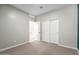 Bedroom with grey walls and carpet at 1523 S 223Rd Dr, Buckeye, AZ 85326