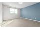 Bedroom with blue accent wall and carpeted floors at 1523 S 223Rd Dr, Buckeye, AZ 85326