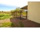 Backyard access through a gated chain link fence at 1628 E Magellan Dr, New River, AZ 85087