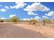 Expansive desert backyard offering privacy and a secure perimeter fence at 1628 E Magellan Dr, New River, AZ 85087