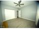 Bedroom with tile floors and double doors at 1628 E Magellan Dr, New River, AZ 85087