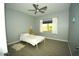 Bedroom with tile floors and ceiling fan at 1628 E Magellan Dr, New River, AZ 85087