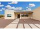 Tan single-story home with gravel yard and paver walkway at 1628 E Magellan Dr, New River, AZ 85087