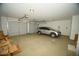 Spacious three-car garage with overhead door at 1628 E Magellan Dr, New River, AZ 85087