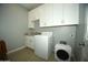 Laundry room with washer, dryer, and cabinets at 1628 E Magellan Dr, New River, AZ 85087