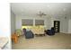 Living room featuring neutral walls, ceiling fan and tiled floors at 1628 E Magellan Dr, New River, AZ 85087