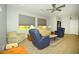 Relaxing living room with ceiling fan and neutral decor at 1628 E Magellan Dr, New River, AZ 85087