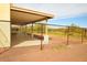 Covered patio area with a chain link fence at 1628 E Magellan Dr, New River, AZ 85087