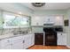 Updated kitchen featuring granite countertops and white cabinets at 16616 E Palisades Blvd # 201, Fountain Hills, AZ 85268