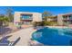 Community pool and building exterior view at 16616 E Palisades Blvd # 201, Fountain Hills, AZ 85268