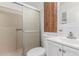 Clean bathroom with shower/tub combo and wood cabinet at 17200 W Bell Rd # 517, Surprise, AZ 85374