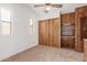 Bedroom with double door closet and ceiling fan at 17200 W Bell Rd # 517, Surprise, AZ 85374