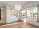 Bright dining room featuring hardwood floors and chandelier at 17200 W Bell Rd # 517, Surprise, AZ 85374