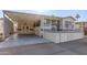 Single-wide manufactured home with carport and elevated deck at 17200 W Bell Rd # 517, Surprise, AZ 85374