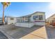 Single-wide manufactured home with carport and elevated deck at 17200 W Bell Rd # 517, Surprise, AZ 85374