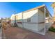 Side view of home with carport and landscaping at 17200 W Bell Rd # 517, Surprise, AZ 85374