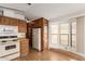 Kitchen with wood cabinets and a refrigerator at 17200 W Bell Rd # 517, Surprise, AZ 85374