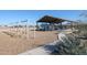 Community playground with swings and covered play area at 17345 W Jessie Ln, Surprise, AZ 85387