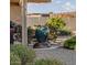 A large, dark-blue ceramic pot sits in the middle of a gravel-covered backyard at 18114 W Desert Sage Dr, Goodyear, AZ 85338