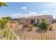 View of backyard with desert landscaping and home at 18114 W Desert Sage Dr, Goodyear, AZ 85338