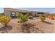 Landscaped backyard with citrus trees and gravel at 18114 W Desert Sage Dr, Goodyear, AZ 85338