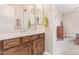 Clean bathroom with wood vanity, updated fixtures, and a neutral color palette at 18114 W Desert Sage Dr, Goodyear, AZ 85338