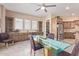 Glass dining table in a well-lit breakfast area at 18114 W Desert Sage Dr, Goodyear, AZ 85338