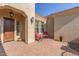 Front entry with red chairs and tile flooring at 18114 W Desert Sage Dr, Goodyear, AZ 85338