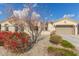 One-story home with landscaped yard and two-car garage at 18114 W Desert Sage Dr, Goodyear, AZ 85338