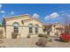 Tan house with arched windows and desert landscaping at 18114 W Desert Sage Dr, Goodyear, AZ 85338