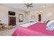 Main bedroom with large windows and a walk-in closet at 18114 W Desert Sage Dr, Goodyear, AZ 85338