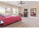 Main bedroom with large windows and a walk-in closet at 18114 W Desert Sage Dr, Goodyear, AZ 85338