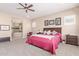 King-size bed in a large main bedroom with ensuite bath at 18114 W Desert Sage Dr, Goodyear, AZ 85338