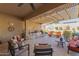 Outdoor patio with seating area, grill, and pergola at 18114 W Desert Sage Dr, Goodyear, AZ 85338