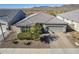 One-story house with a tile roof, driveway, and desert landscaping at 1866 N 214Th Ln, Buckeye, AZ 85396