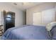 Bedroom with a queen bed, large closet and dresser at 1866 N 214Th Ln, Buckeye, AZ 85396