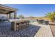 Enjoy outdoor entertaining with a built-in BBQ and bar seating at 1866 N 214Th Ln, Buckeye, AZ 85396