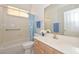 Clean bathroom with a tub, shower, and updated vanity at 18840 N 83Rd Ln, Peoria, AZ 85382