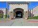 Inviting community entrance with stone accents and landscaping at 18840 N 83Rd Ln, Peoria, AZ 85382