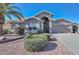 Single-story home with attractive landscaping and a two-car garage at 18840 N 83Rd Ln, Peoria, AZ 85382