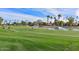 Scenic golf course with water features and lush green fairways at 18840 N 83Rd Ln, Peoria, AZ 85382