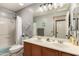 Bathroom with double vanity and bathtub shower combo at 18927 N Leland Rd, Maricopa, AZ 85138