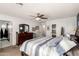 Main bedroom with king-size bed, dresser, and bathroom access at 18927 N Leland Rd, Maricopa, AZ 85138