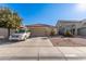 Single-story home with a two-car garage and desert landscaping at 18927 N Leland Rd, Maricopa, AZ 85138