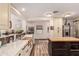 Modern kitchen featuring white cabinets, farmhouse sink, and butcher block island at 18927 N Leland Rd, Maricopa, AZ 85138