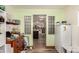 Laundry room with built-in shelving and access to kitchen at 18927 N Leland Rd, Maricopa, AZ 85138