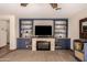 Living room with built-in shelving and fireplace at 18927 N Leland Rd, Maricopa, AZ 85138