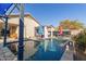 Relaxing pool area with multiple umbrellas and patio furniture at 18927 N Leland Rd, Maricopa, AZ 85138