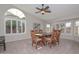 Light-filled dining room with large windows and tile flooring at 19122 N 90Th Dr, Peoria, AZ 85382